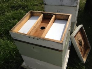 One of two taks to prep your hives for winter by feeding wiht a hive top feeder